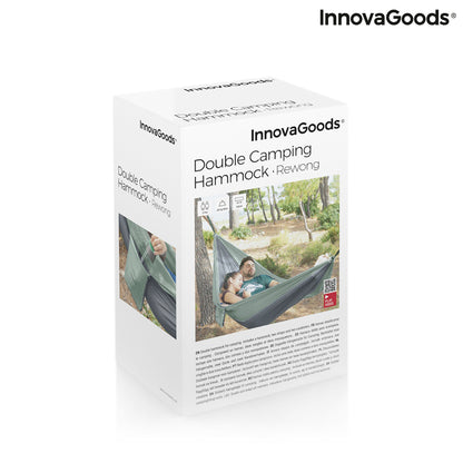 Double camping hammock by Bigbuy for outdoor relaxation, shown hanging between trees with a blue fabric and sturdy ropes.