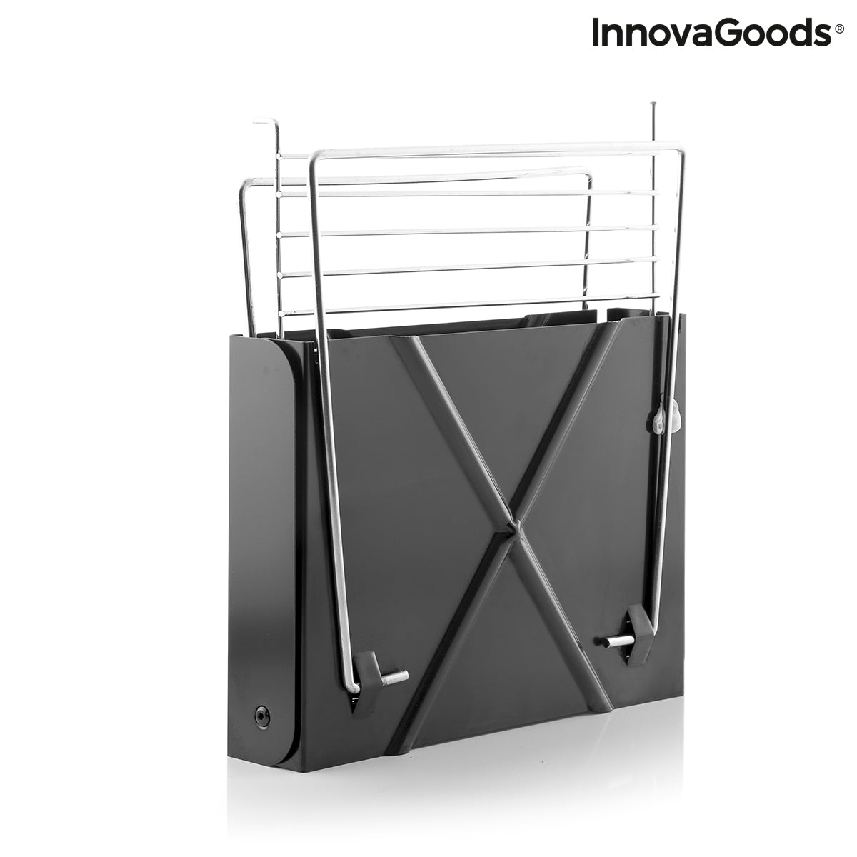 Bigbuy Foldecue InnovaGoods mini folding portable charcoal barbecue in a garden setting, showing its compact design and cooking surface.