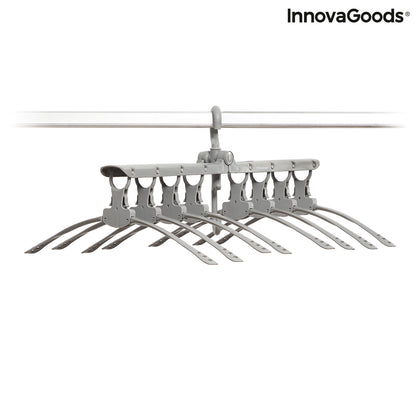 InnovaGoods 8-in-1 Multi Hanger Spavver for organizing clothes and accessories, black plastic with multiple hooks and compartments.