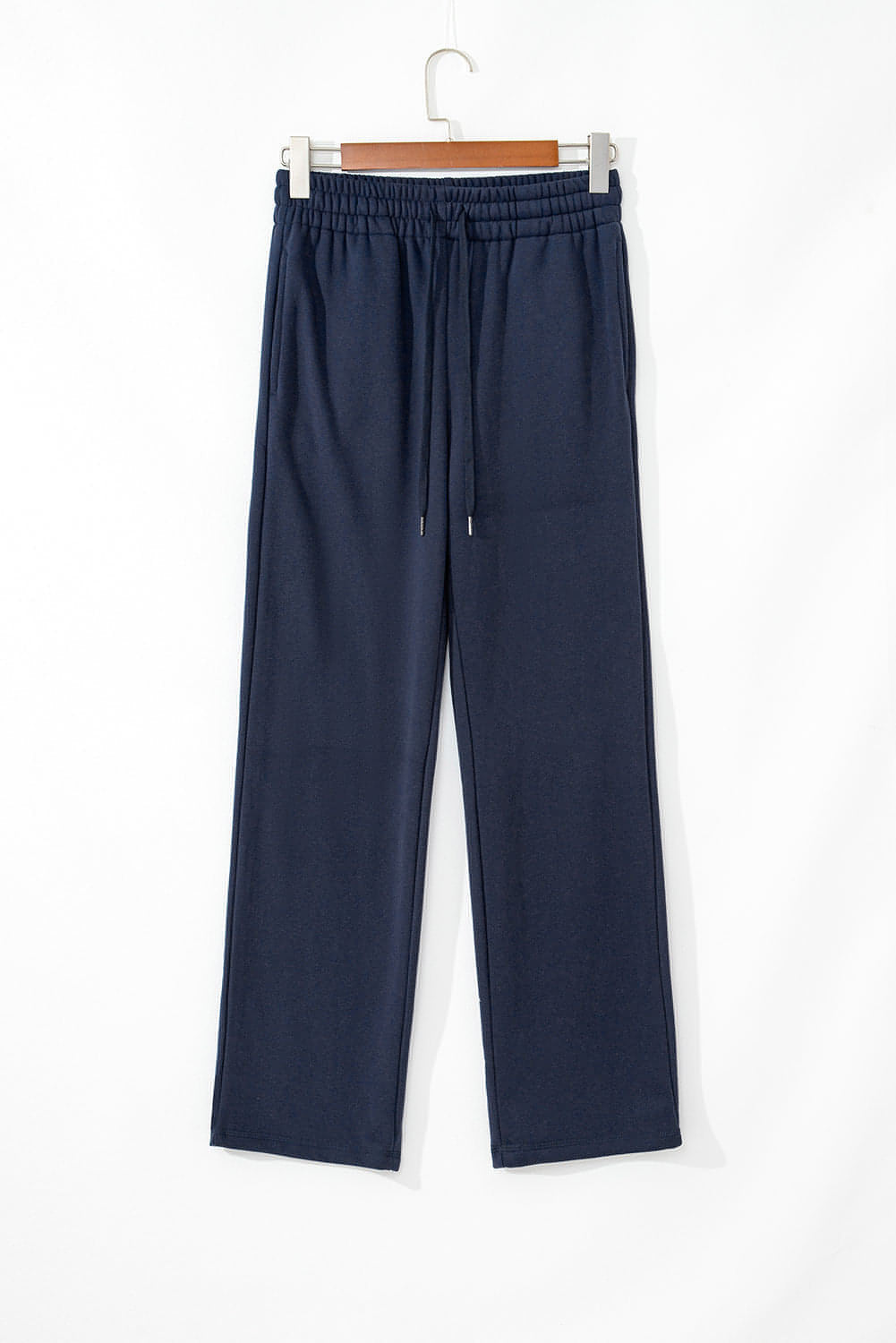 Navy blue fleece-lined casual pants with drawstring waist from Carmine Juneberry, comfortable and stylish for everyday wear.