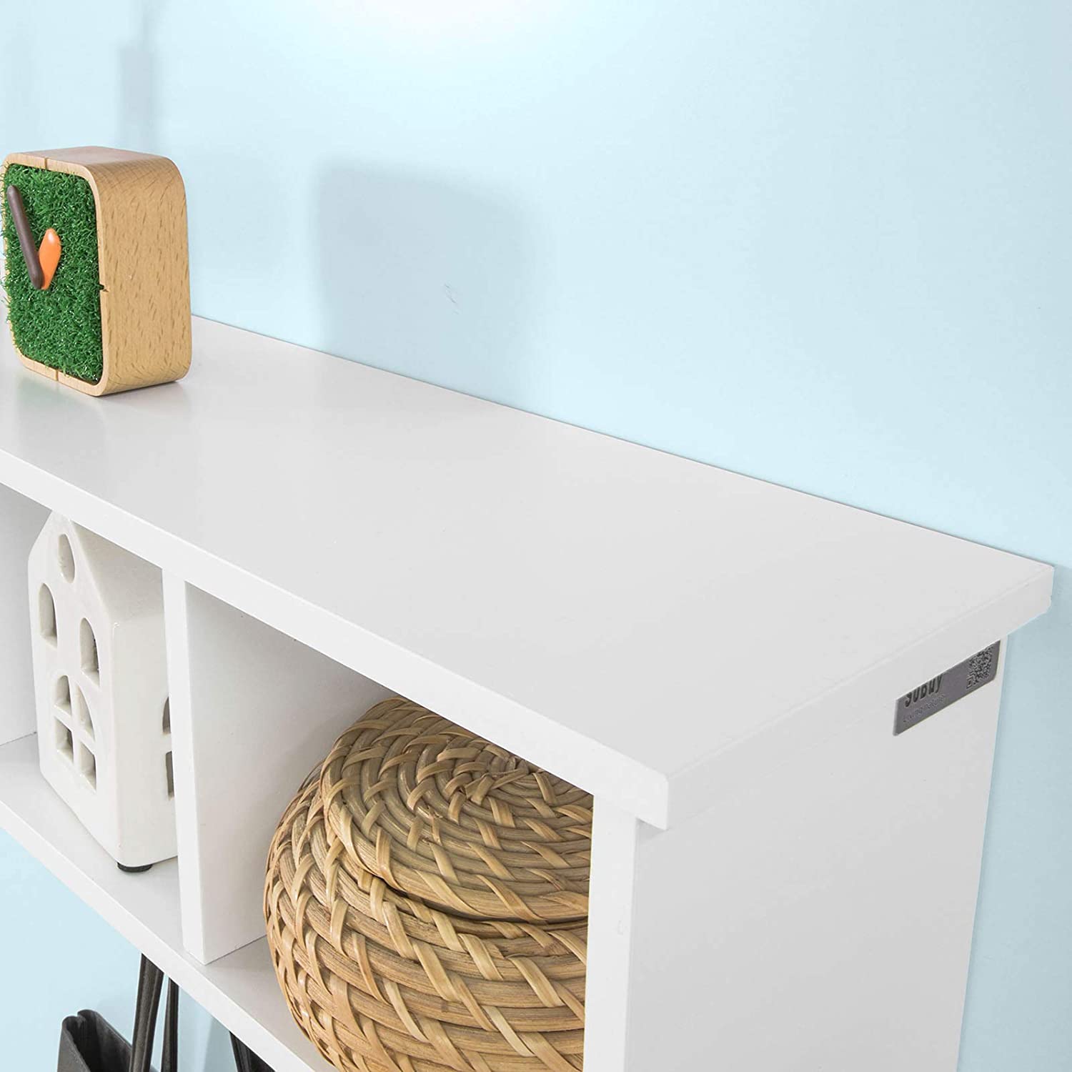 White wall shelf coat rack by Carmine Deianeira, featuring hooks and shelf for home organization and decor.