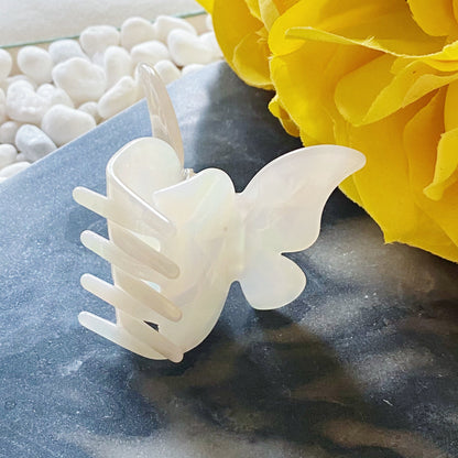 Fuchsia Hercules butterfly-shaped hair claw jewelry accessory with metal and decorative design for stylish hair styling.