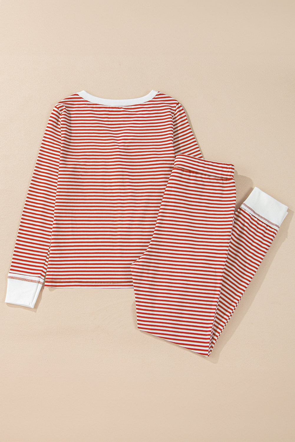 Byzantium Bay Christmas stripe lounge set with matching top and pants, featuring festive red and white holiday patterns.