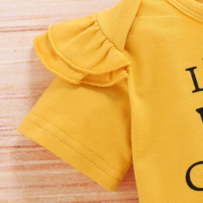 Three-piece baby girl sunflower outfit by Carmine Juneberry featuring a sunhat, dress, and bloomers for sunny days.