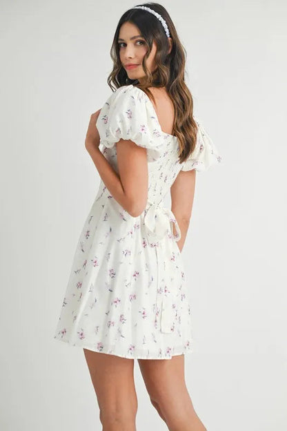 Pear Daisy floral print puff sleeve mini dress with a feminine design, perfect for spring and summer fashion.