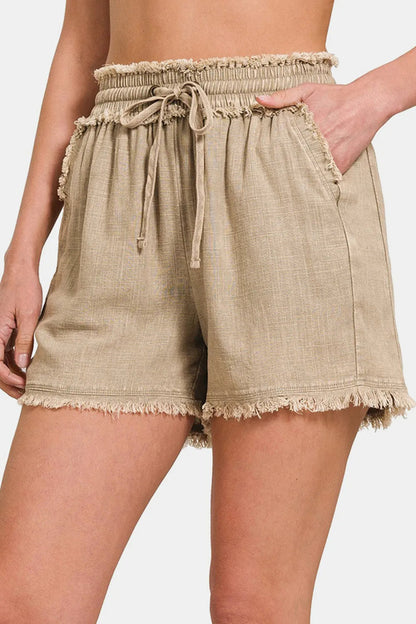 Zenana washed linen frayed hem drawstring shorts in neutral tones, perfect for home and garden lounging.
