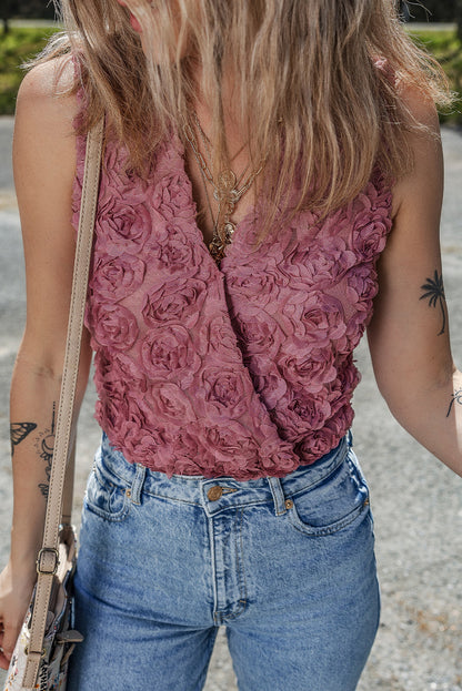 Floral textured V-neck sleeveless bodysuit by Byzantium Bay, showcasing intricate floral print and wrapped design.