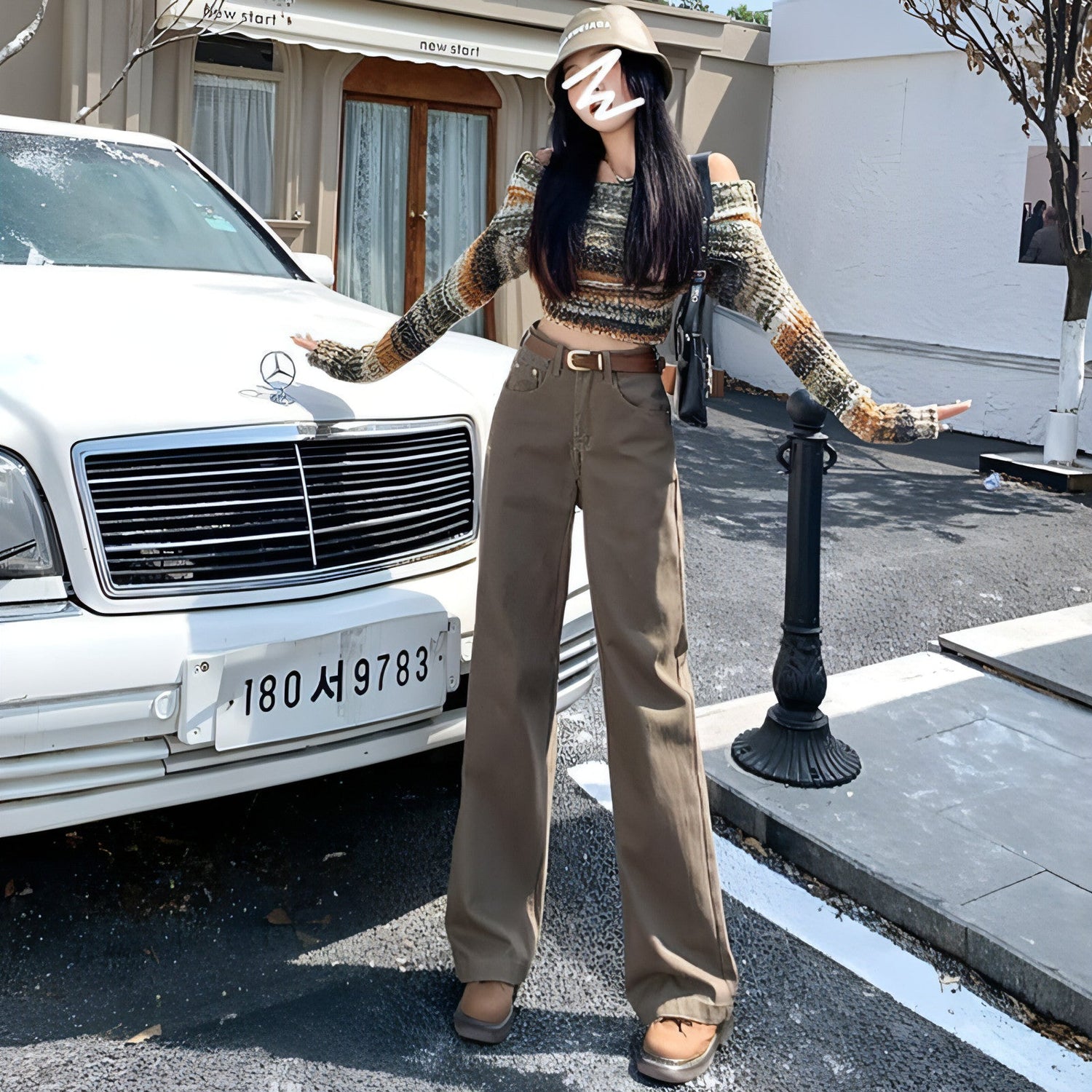 Carmine Juneberry DenimDare™ brown high waist retro jeans with classic fit and vintage style, displayed on a hanger.