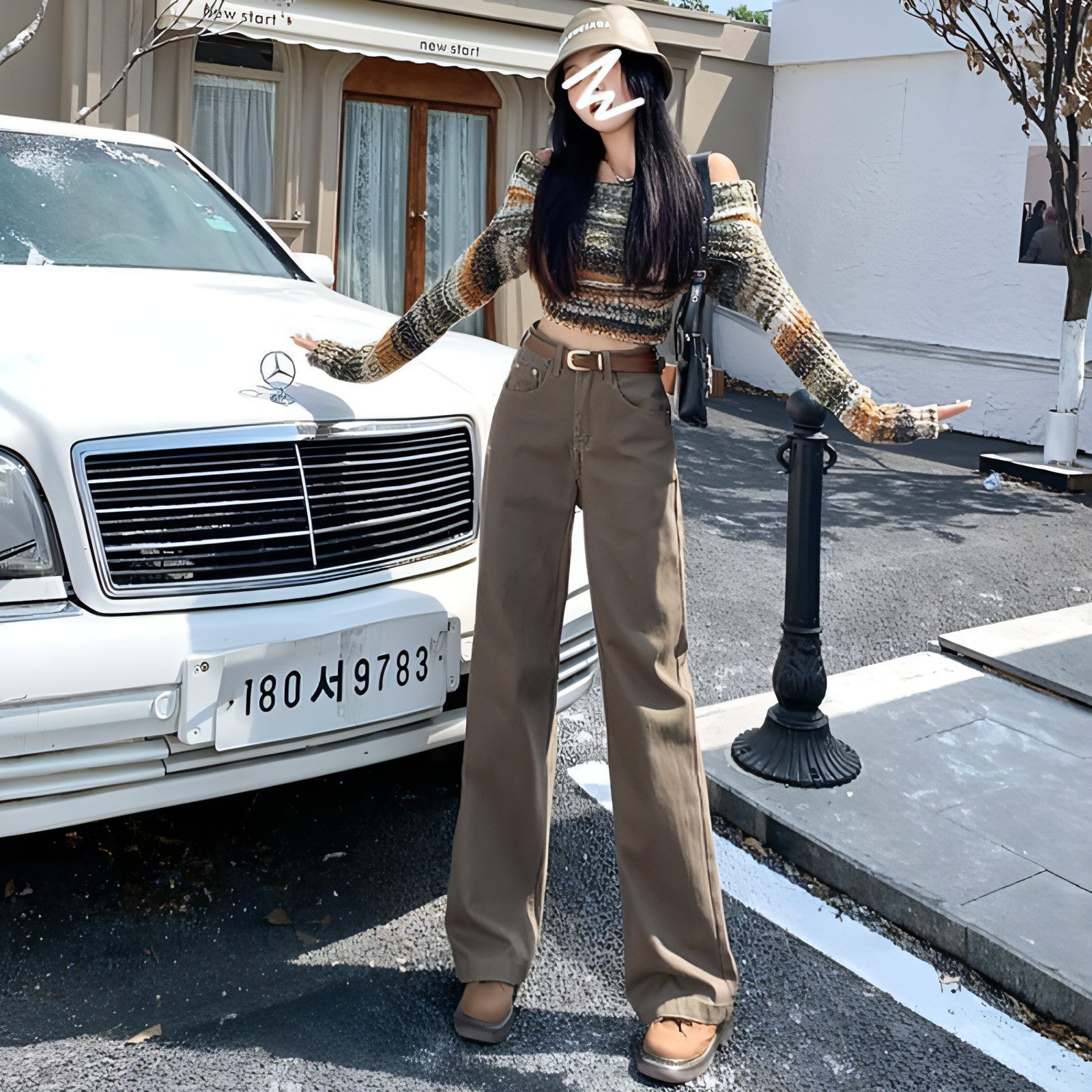 Carmine Juneberry DenimDare™ brown high waist retro jeans with classic fit and vintage style, displayed on a hanger.