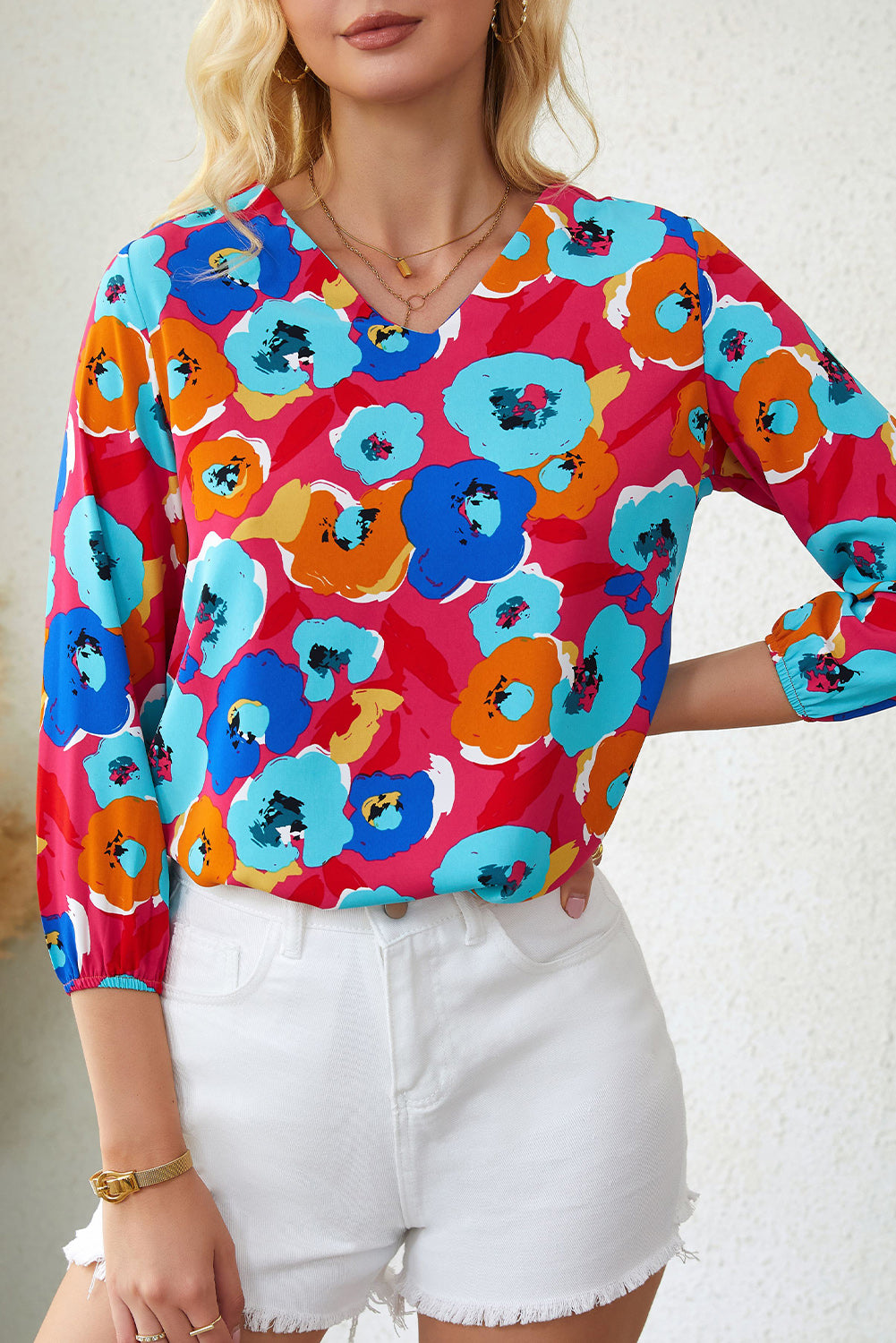 Multicolor floral print V-neck blouse with 3/4 sleeves by Carmine Juneberry, perfect for casual or dressy occasions.