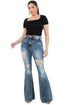 Jade Icarus Storm Bell Bottom Jean with 30-inch inseam, showcasing the denim fabric and flared design on a model.