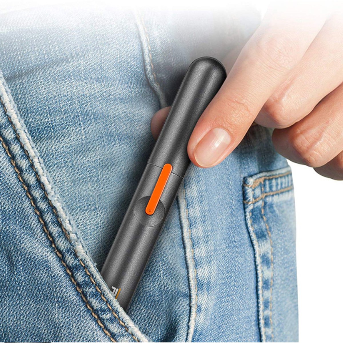 Salmon Lucky vanity hair trimmer for ears and nose, compact tech accessory with stainless steel trimming heads for precise grooming.