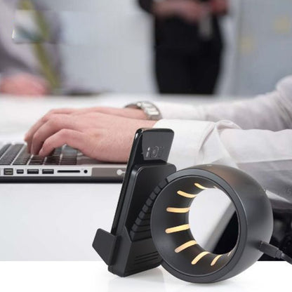 Salmon Lucky Wheel Of Power mobile wireless charger in sleek black design, showcasing its circular shape and charging surface.