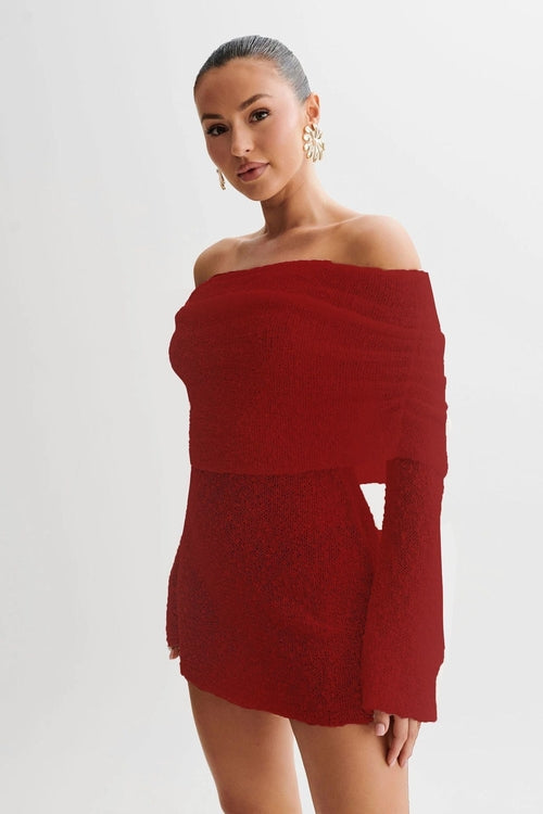 Carmine Juneberry 25 Edition off-shoulder knit bodycon dress in black, featuring a fitted silhouette and long sleeves.