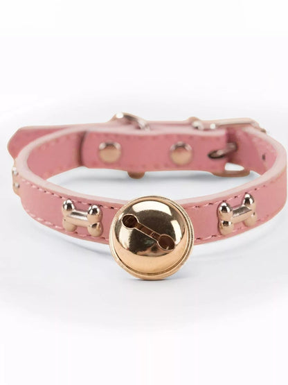 Leather pet collar with bell from Pear Daisy featuring durable construction and a small bell for easy pet identification.