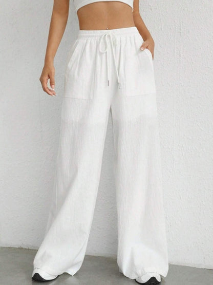 Carmine Juneberry drawstring wide-leg pants in lightweight fabric with relaxed fit and high waist.