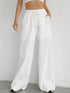 Carmine Juneberry drawstring wide-leg pants in lightweight fabric with relaxed fit and high waist.