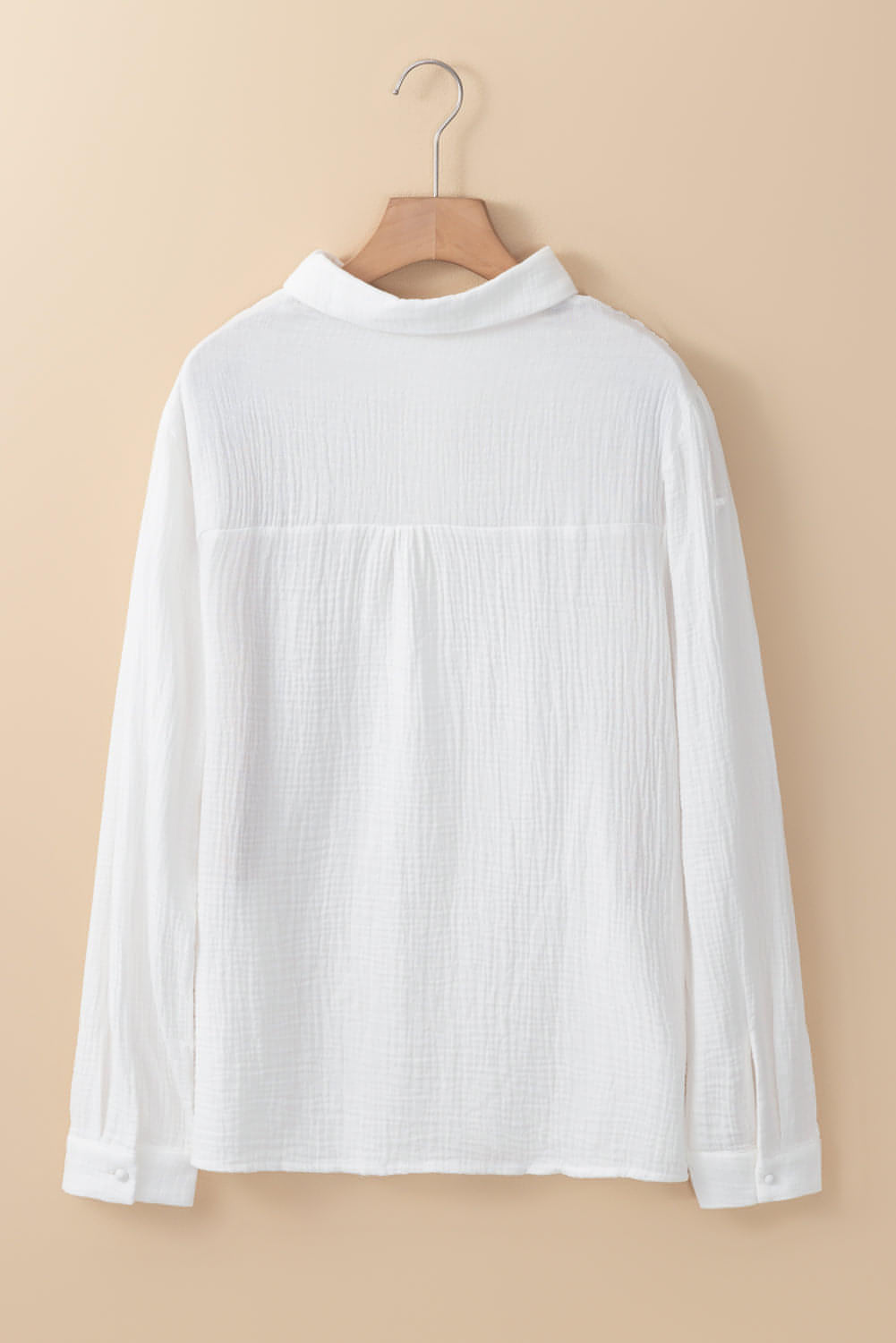 White floral lace splicing crinkled blouse from Carmine Juneberry, featuring hollow-out design and delicate lace details.