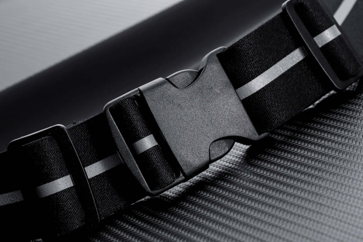 Black Lavender water-resistant sport waist pack with reflective strip, ideal for running and outdoor activities.