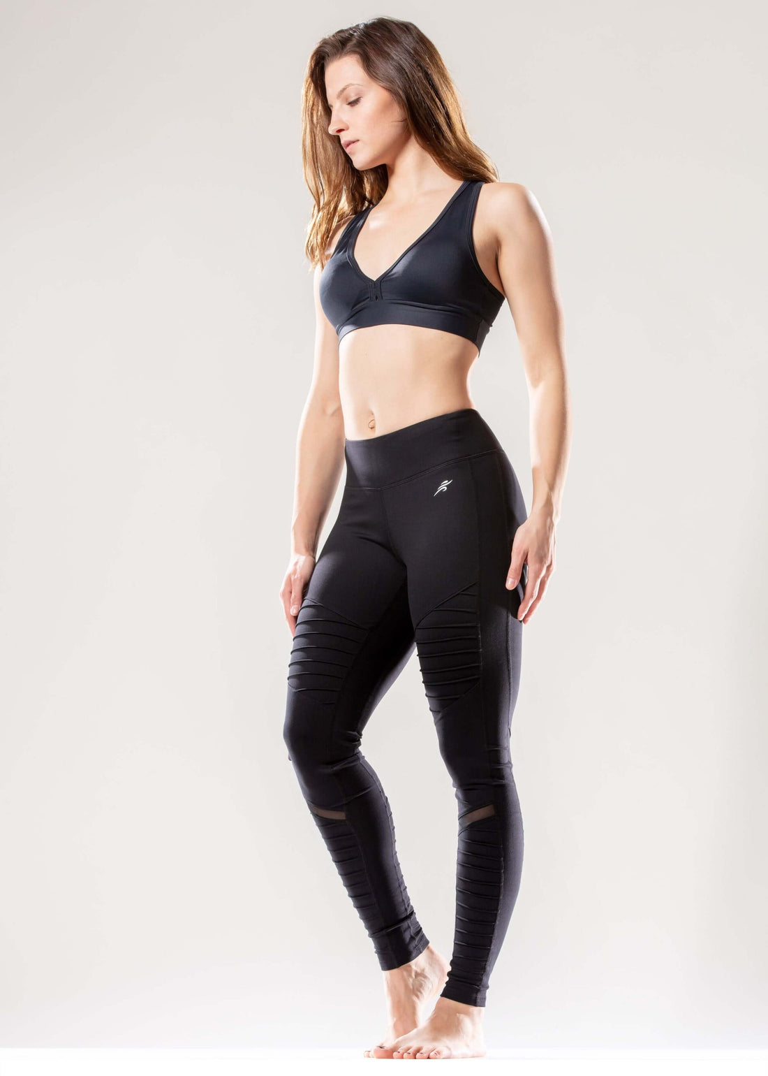 Black Lavender Athletique low-waisted ribbed activewear leggings with hidden pocket and mesh panels, shown on a model.