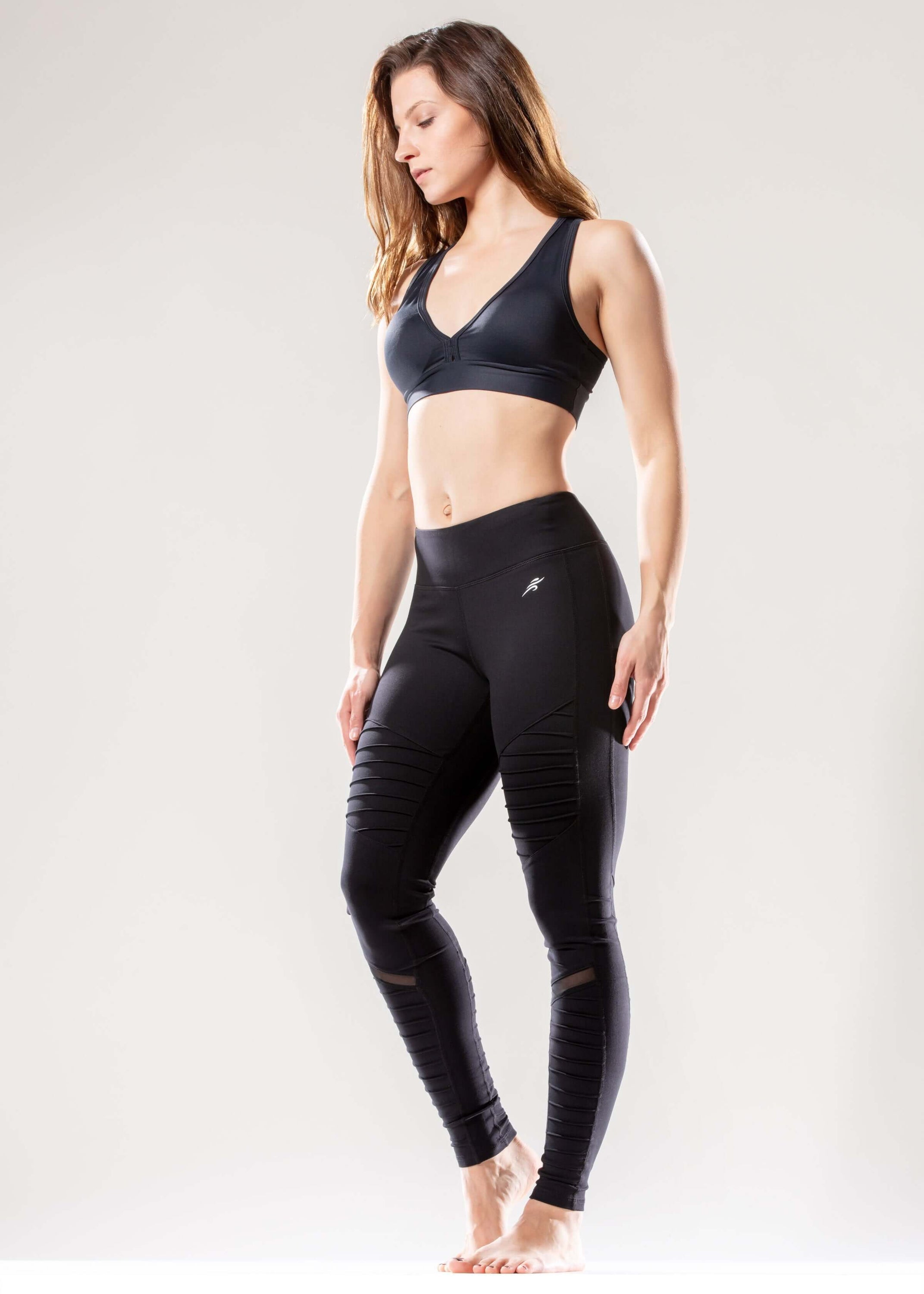 Black Lavender Athletique low-waisted ribbed activewear leggings with hidden pocket and mesh panels, shown on a model.