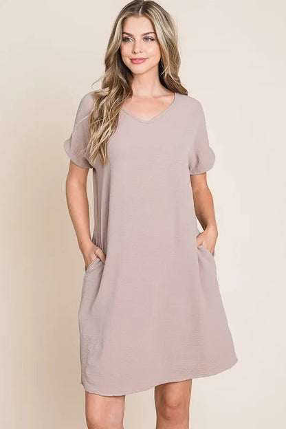 Automotive-themed Jade Icarus BOMBOM V-neck short sleeve dress with pockets, featuring a stylish design and comfortable fit.