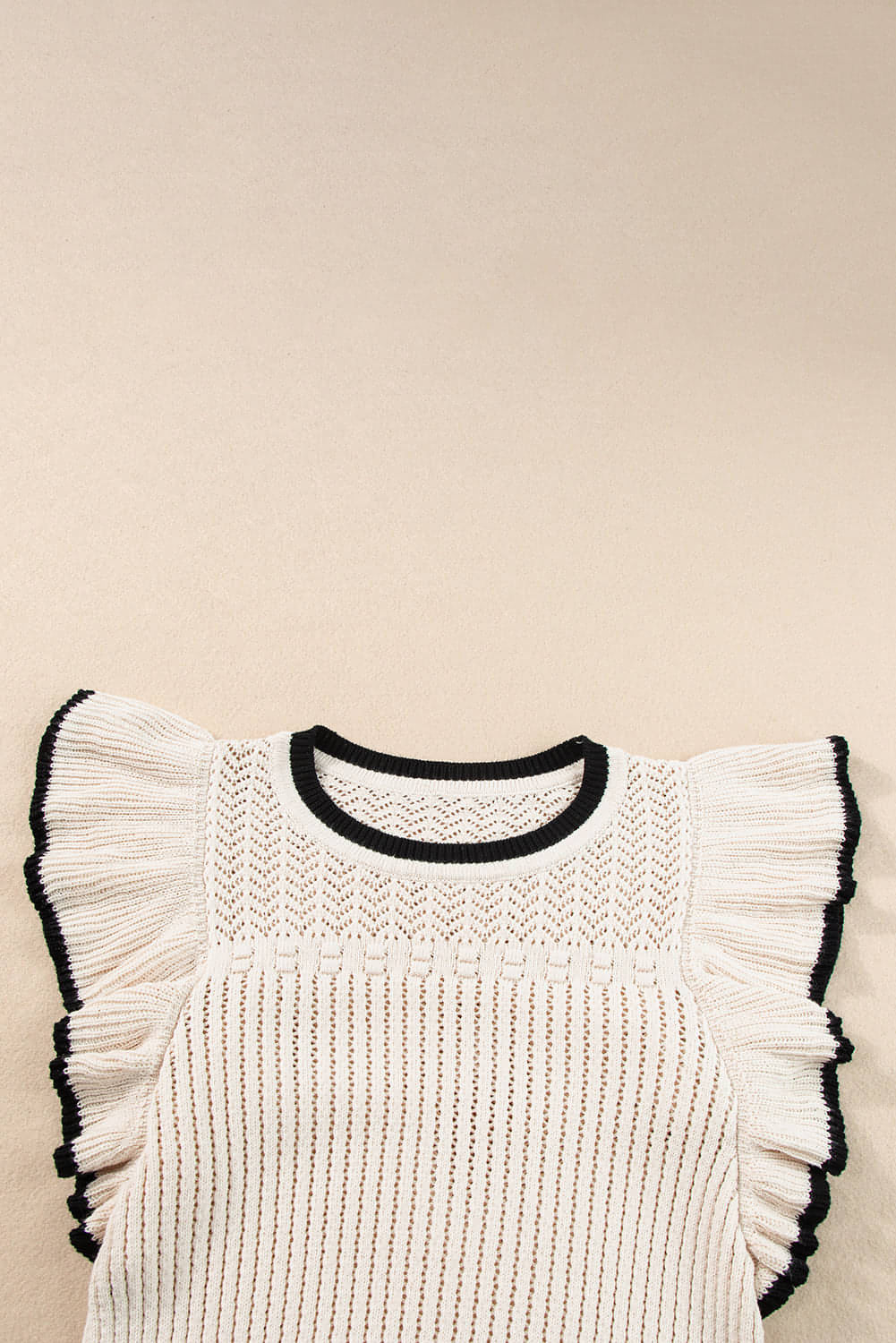 Apricot crochet eyelet flounce tank top by Carmine Juneberry, featuring delicate eyelet details and a flowy, feminine silhouette.