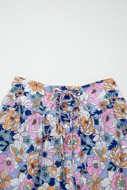 Floral lace-up high waist ruffle maxi skirt for women by Byzantium Bay, featuring floral pattern and flowing design.