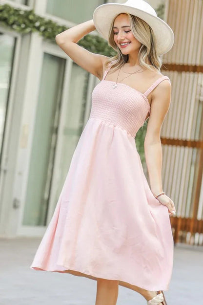 Jade Icarus smocking open-back sleeveless midi dress for women, featuring a fitted bodice and flowing skirt, perfect for summer wear.
