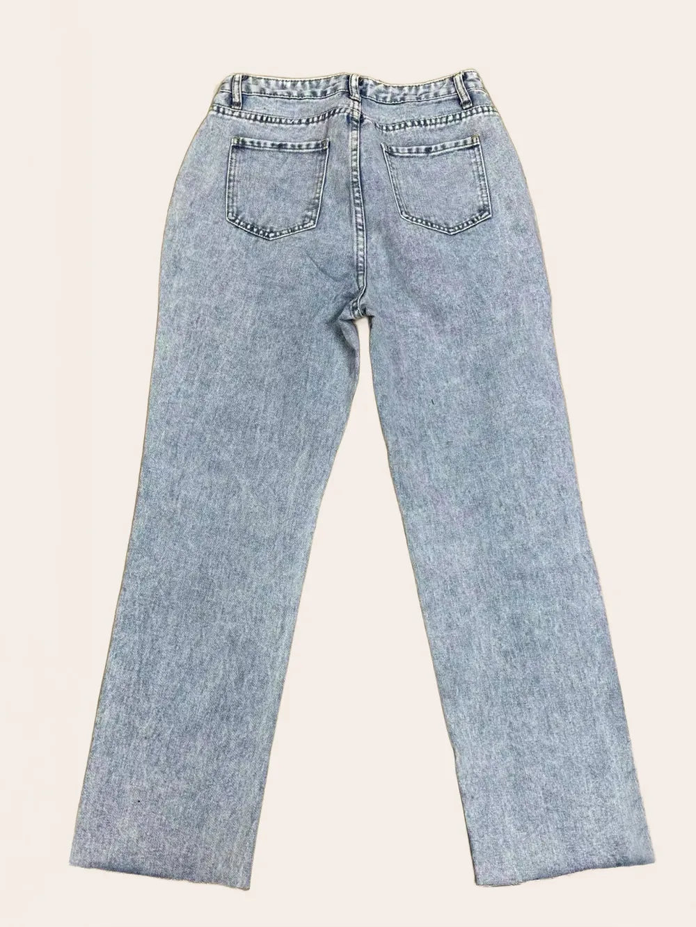 Pear Daisy distressed straight leg jeans with pockets, showcasing a casual fit and worn-in denim style.
