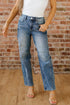 Vintage washed denim shift jeans for women by Byzantium Bay, showing a close-up of the classic seam design and distressed details.