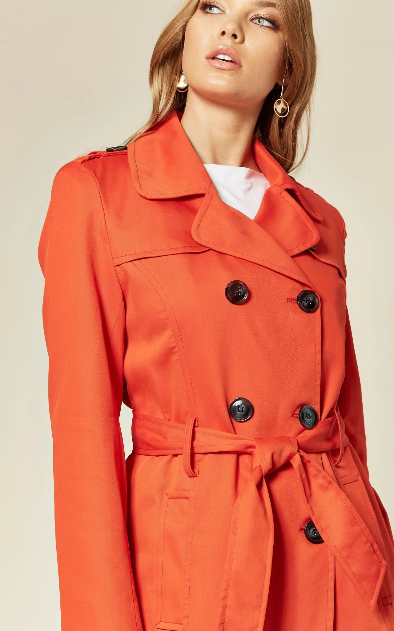 Rose Eleusis military double-breasted trench coat in spring/summer style, shown on a model with a classic design and lightweight fabric.