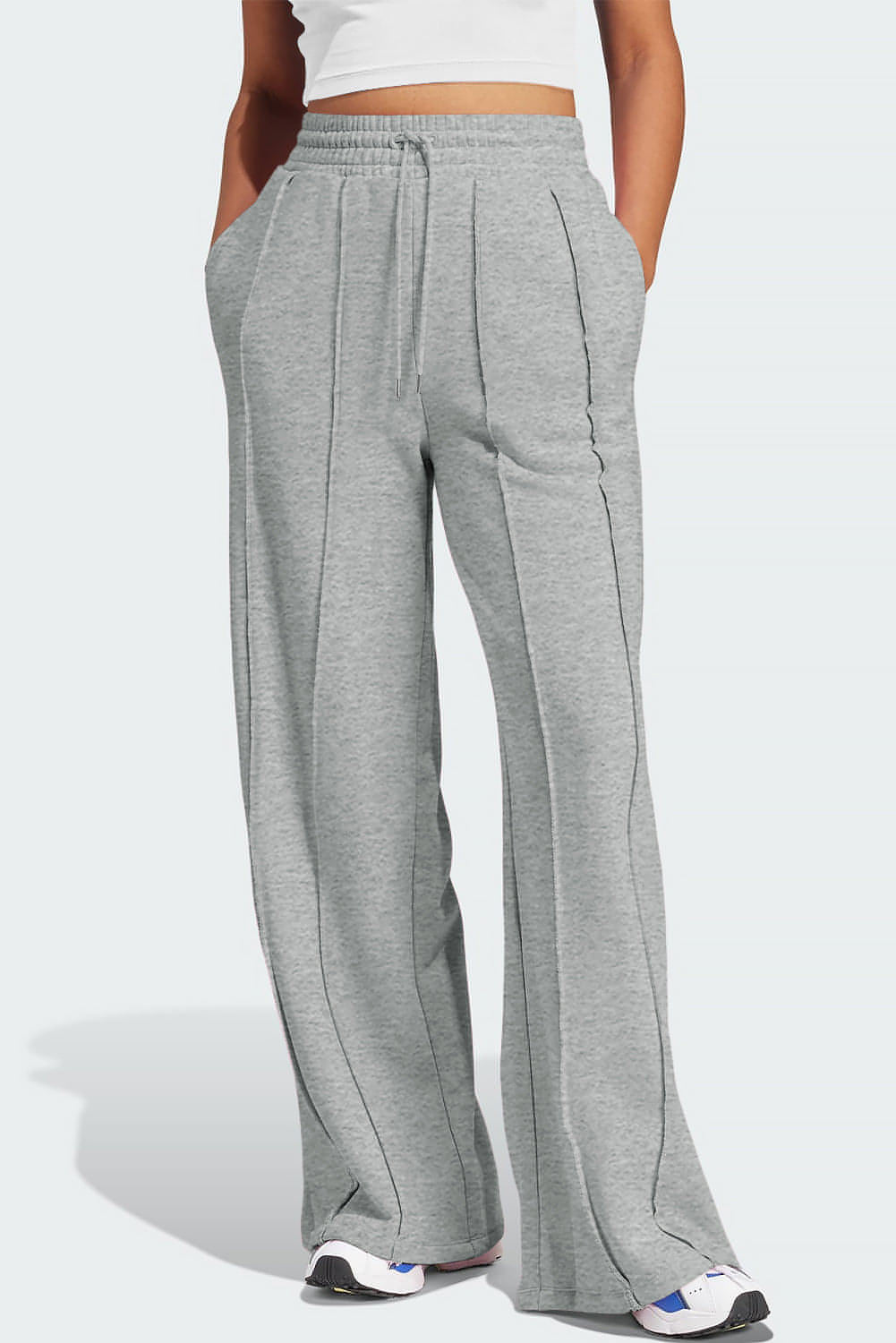 Gray seamed high waist wide-leg sweatpants by Carmine Juneberry featuring drawstring waist and relaxed fit.