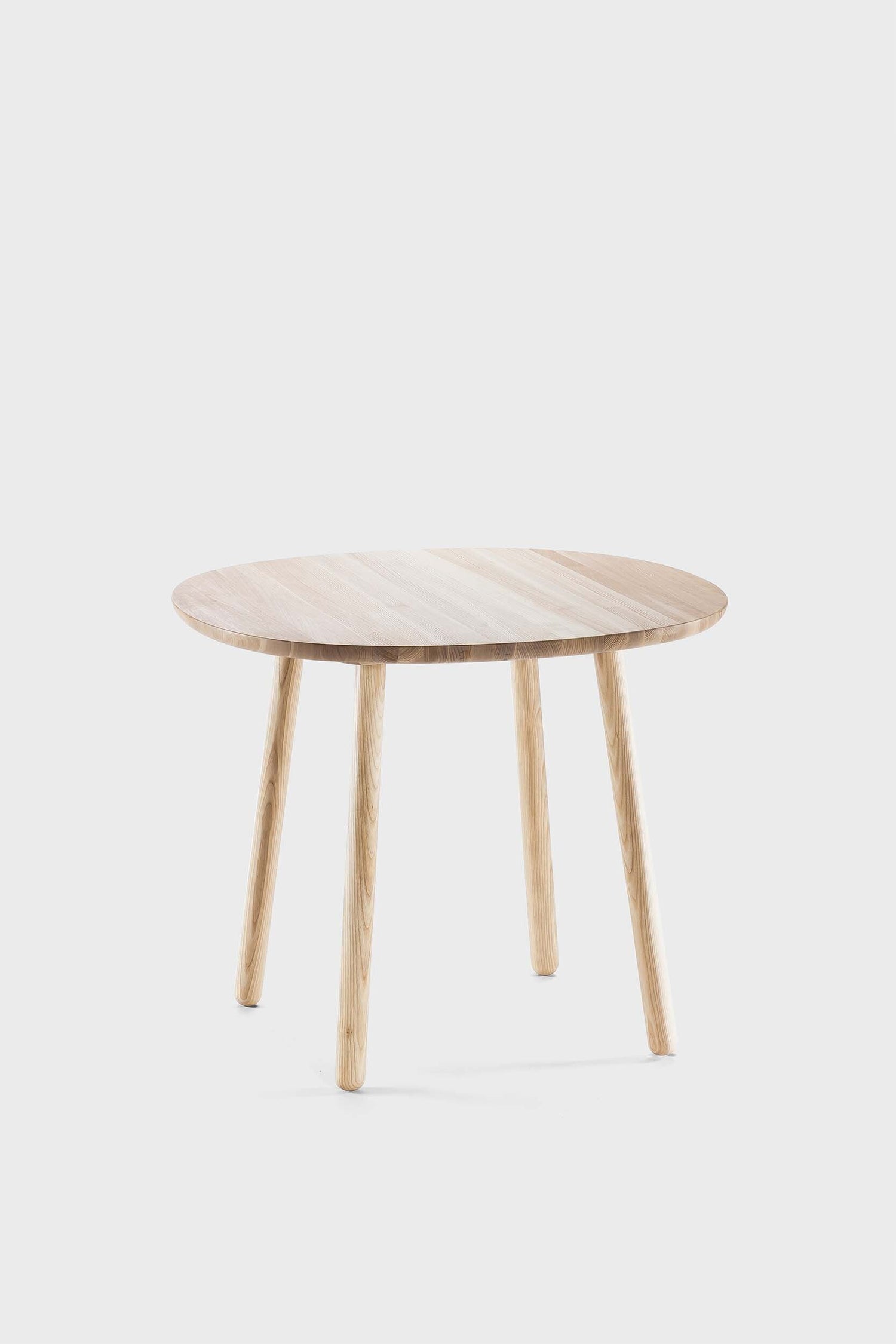 Natural wood Naïve dining table by Aquamarine Poppy with a smooth surface and sturdy legs, ideal for modern dining rooms.