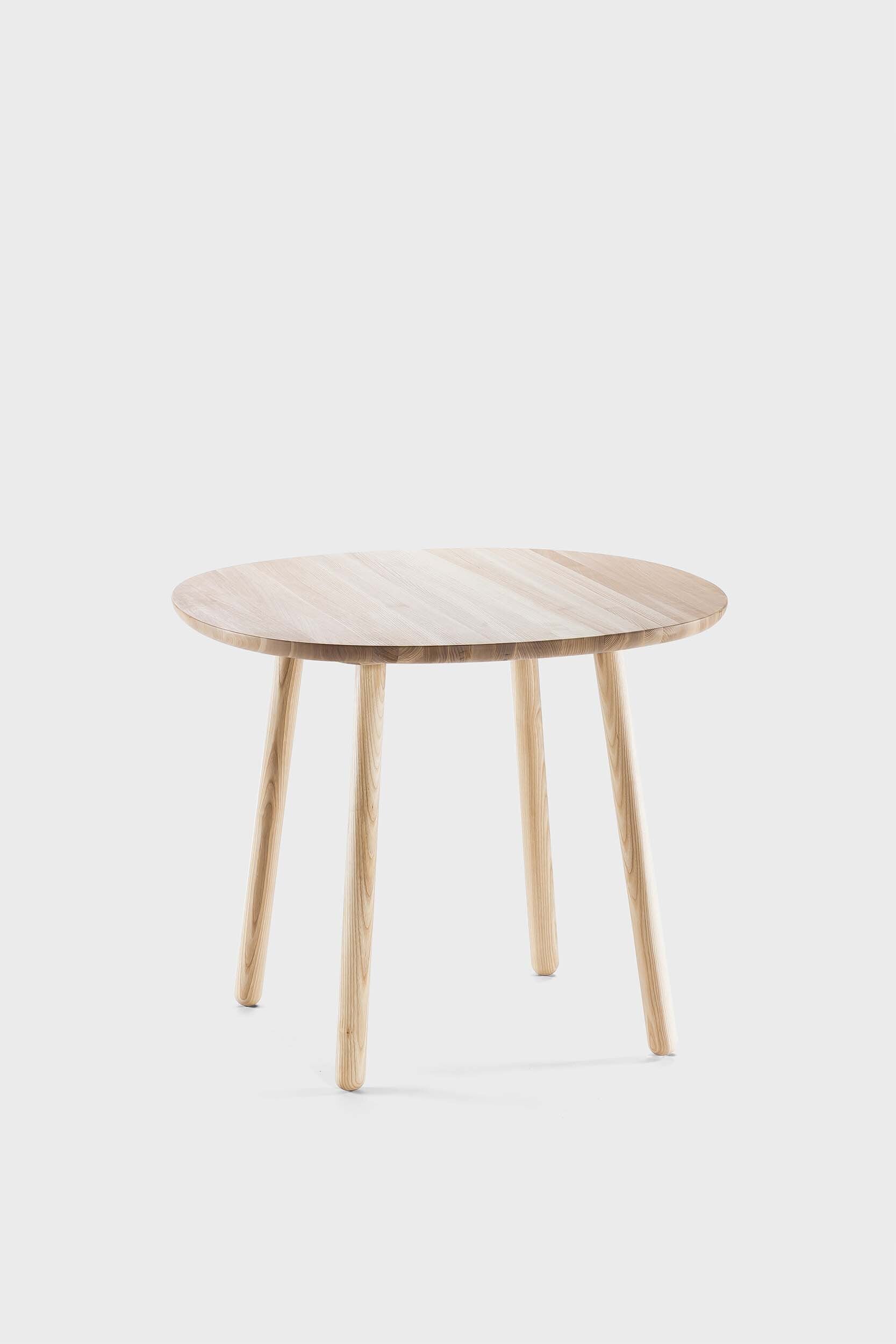 Natural wood Naïve dining table by Aquamarine Poppy with a smooth surface and sturdy legs, ideal for modern dining rooms.