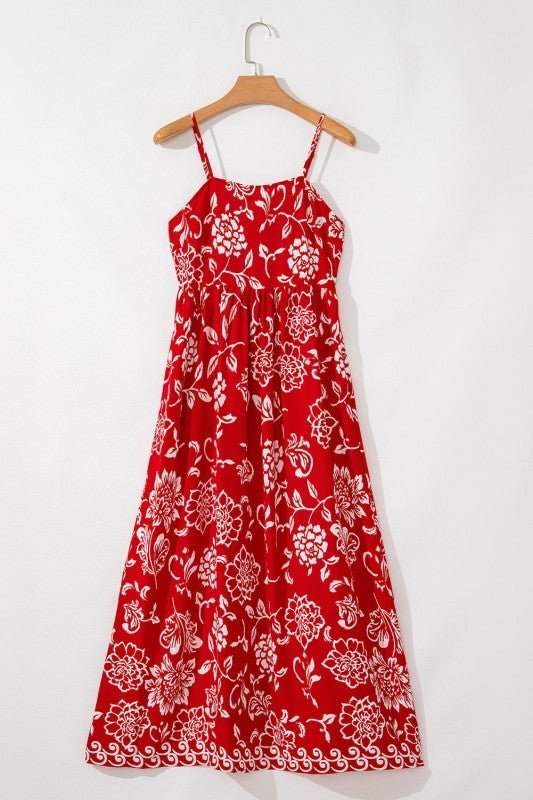 Red floral print spaghetti strap empire waist maxi dress for women by Jade Icarus, featuring a flowy silhouette and vibrant pattern.