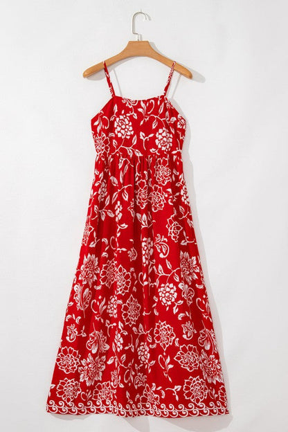 Red floral print spaghetti strap empire waist maxi dress for women by Jade Icarus, featuring a flowy silhouette and vibrant pattern.