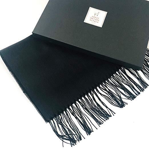Black alpaca and silk shawl from Aegerine featuring a soft, luxurious blend of 70% baby alpaca and 30% silk.