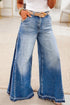 Women’s denim flare leg pants with gathered side seams by Byzantium Bay, showcasing stylish high-waisted design and tapered fit.