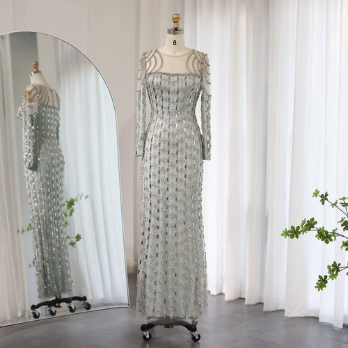 Carmine Juneberry long sleeve slim fishtail dress featuring a fitted silhouette and elegant design, shown in the image.