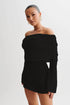 Carmine Juneberry 25 Edition off-shoulder knit bodycon dress in black, featuring long sleeves and a fitted silhouette.