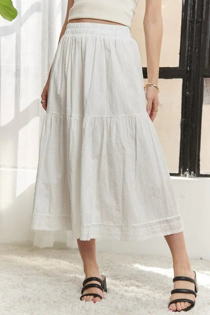 Jade Icarus ADORA elastic waistband tiered midi skirt in a stylish, flowing design with layered fabric for a chic look.