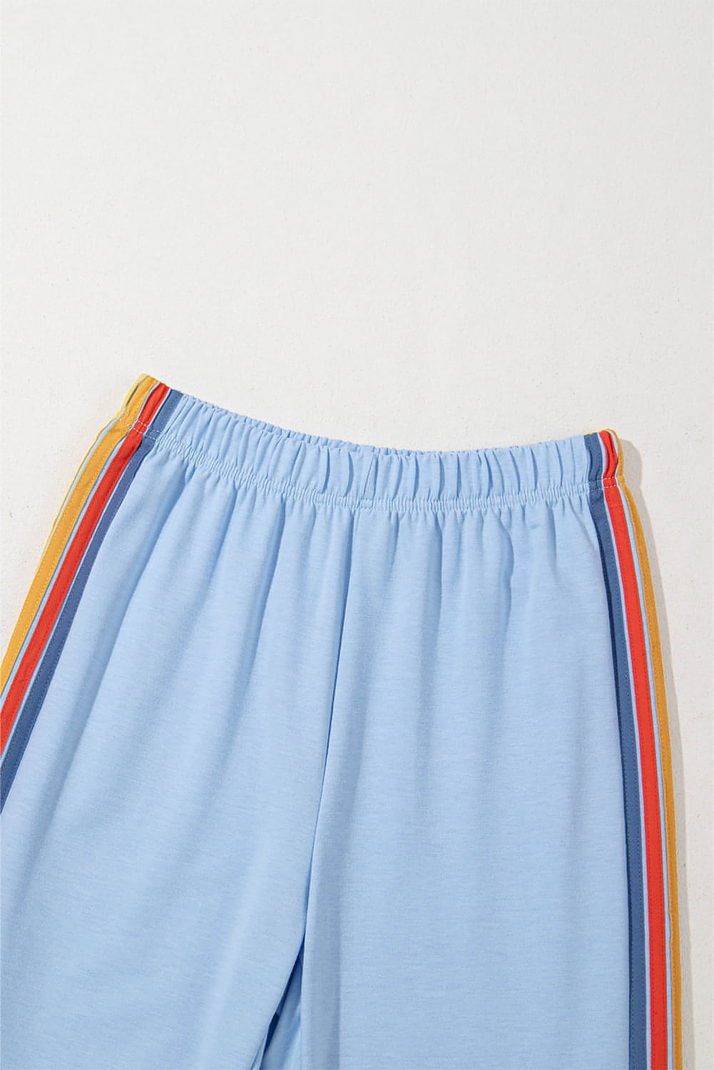 Light blue high waist sweatpants with rainbow counting design from Carmine Juneberry, casual pants for comfortable wear.