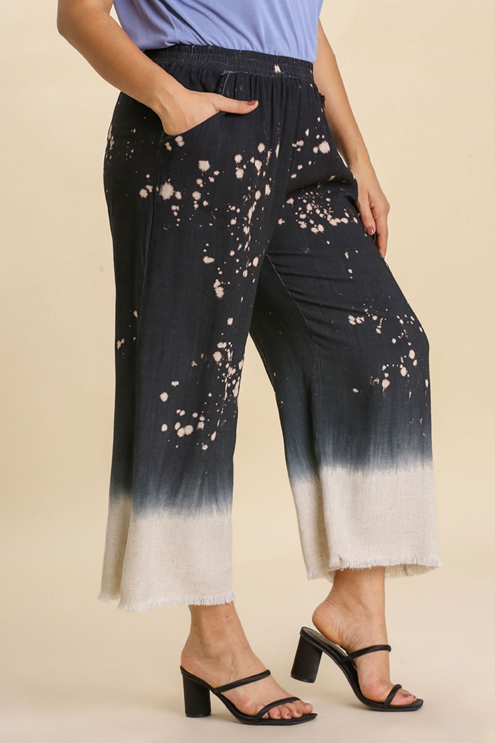 Jade Icarus Umgee wide-leg linen blend bleach dip dye pants with raw hem, full size, laid flat showing the colorful, distressed style.