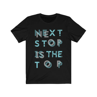 Plum Charlie "Next Stop is The Top" T-shirt featuring bold text design on a casual cotton shirt.