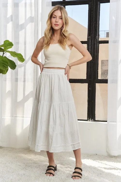 Jade Icarus ADORA elastic waistband tiered midi skirt, designed with a flowing, layered fabric for a stylish look.