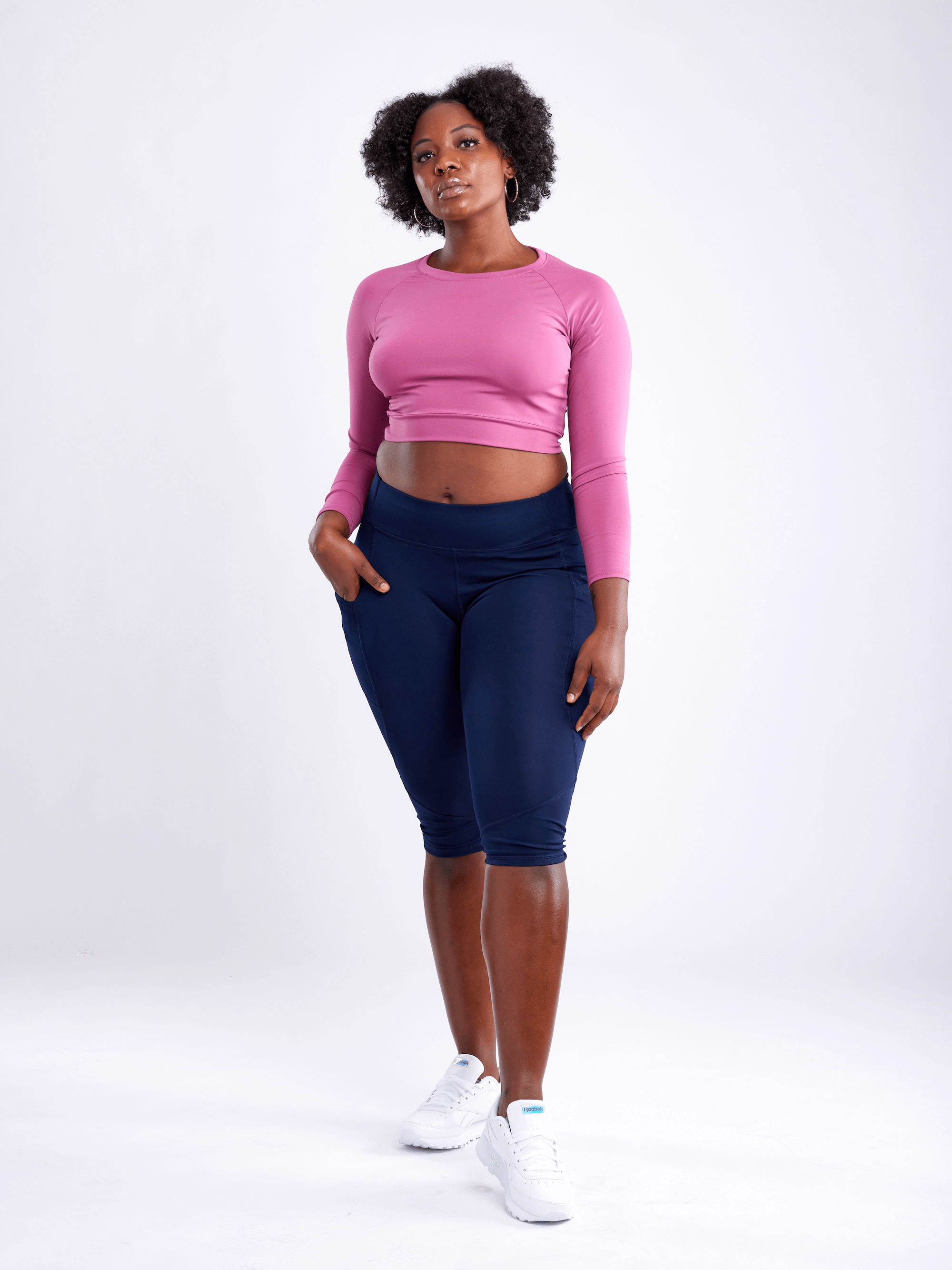 Black Lavender JupiterGear long-sleeve crop top, activewear with fitted design and crew neckline, shown in black fabric.