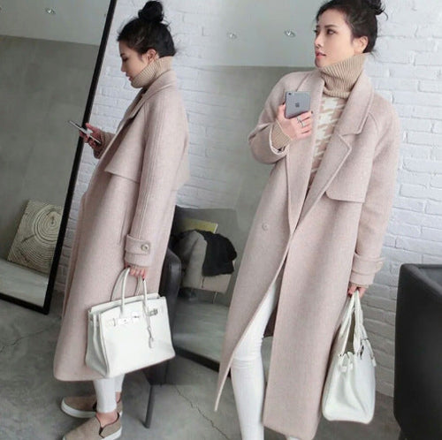 Black silhouette overcoat from Carmine Juneberry Haute Edition 25, stylish jacket with a sleek, elegant design.