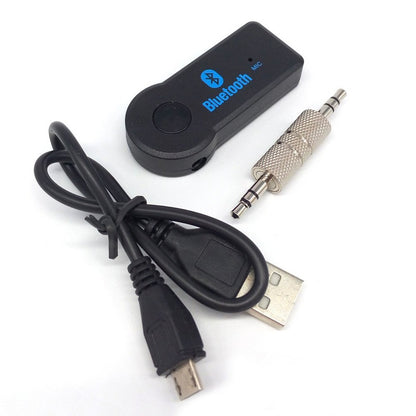 Fuchsia Molly HiFi Bluetooth music receiver connected to audio equipment, showcasing sleek design and compact size.