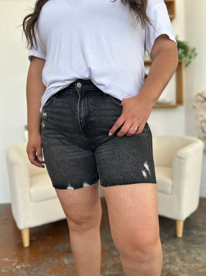 Judy Blue high waist rigid magic denim shorts for women, showcasing classic fit and distressed details.